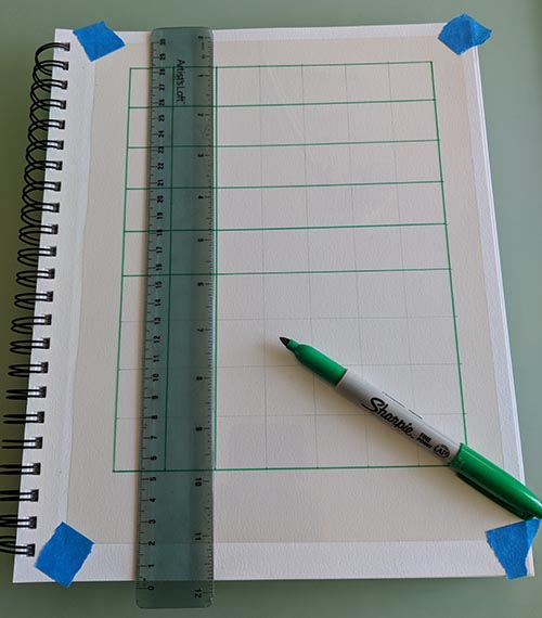 A picture of a grid being drawn on a transparency. 