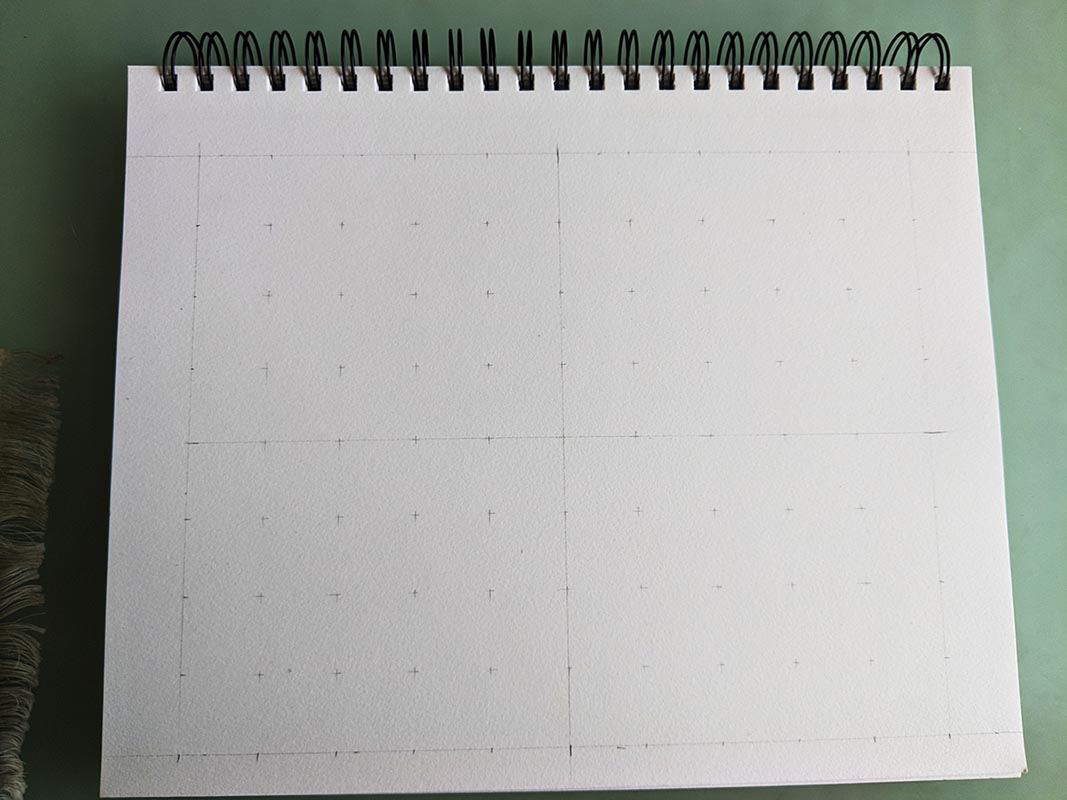 A picture of a sketchpad with a grid drawn on it.