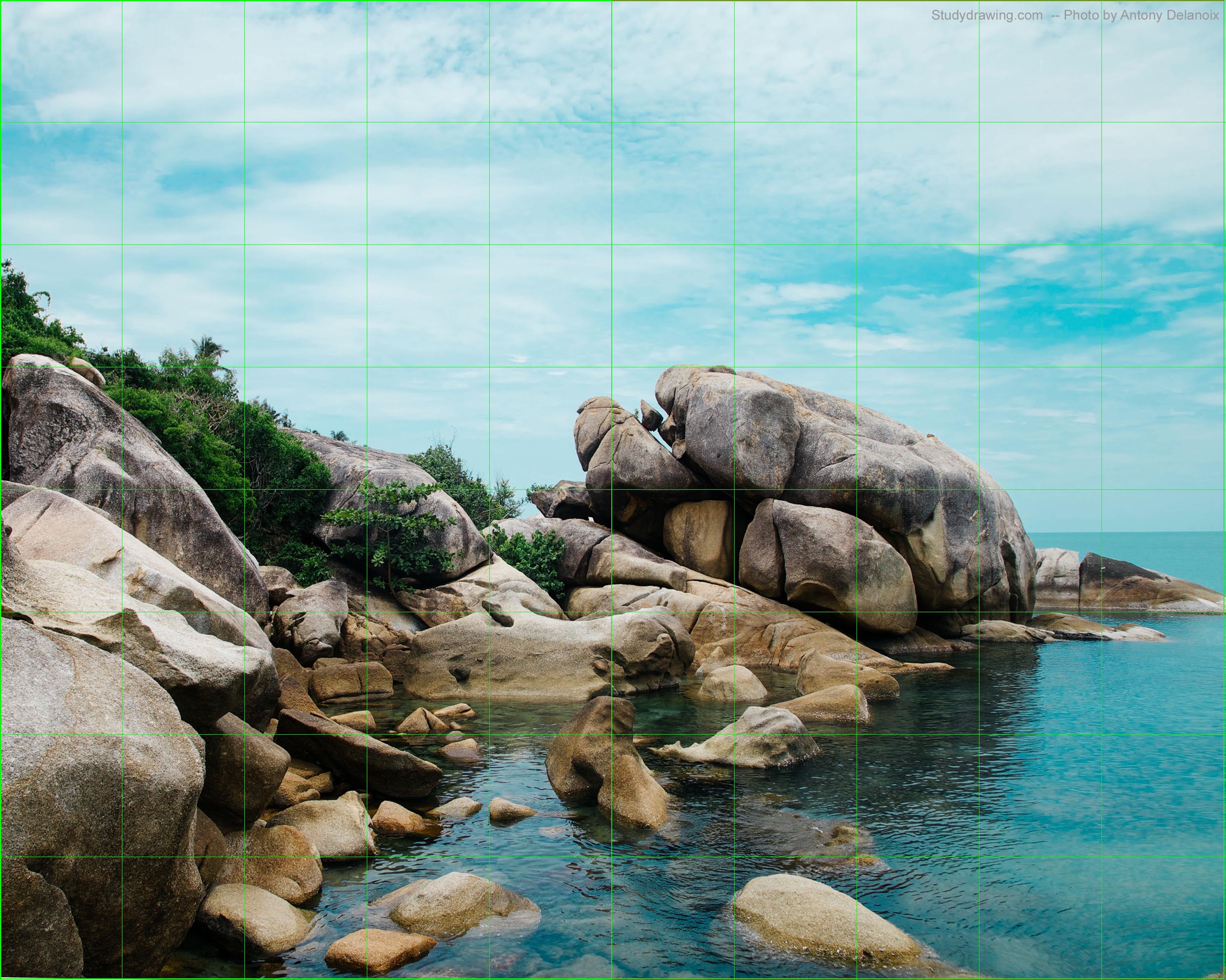 A picture of a rocky oceanside with a grid overlaid.