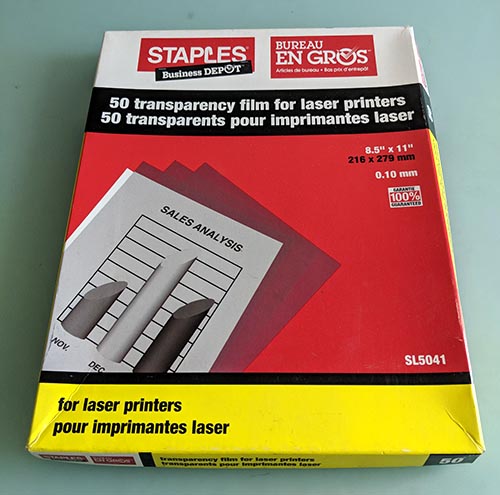 A photo of a pack of transparency film for laser printers. 