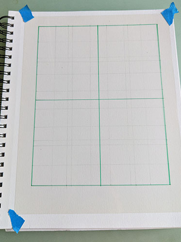 A picture of a sketchbook with a transparency and grid. 