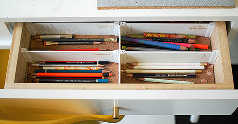 A picture of pencils in a drawer.